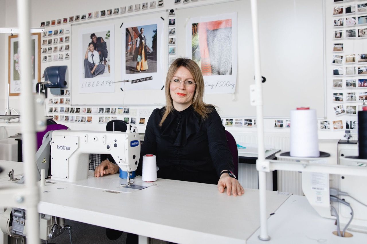 Jenna Gardner seated at a sewing machine in the Fashion department at Blackburn College. Image: Christina Davies, Fish2Photo.