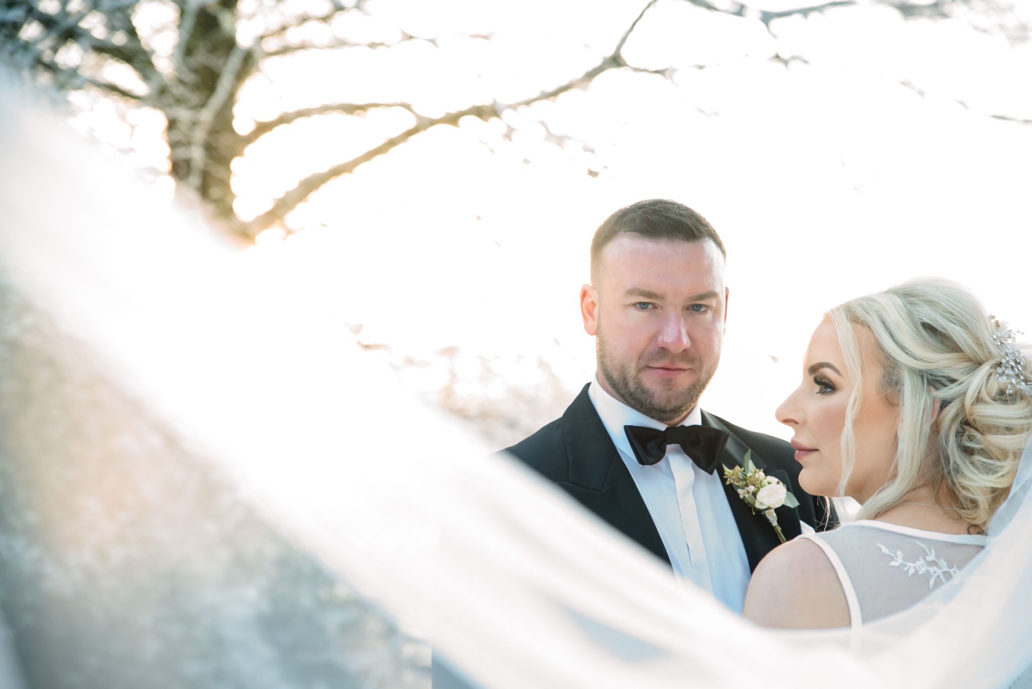 Wedding portrait close up of couple. Image by Rachel Ovenden.