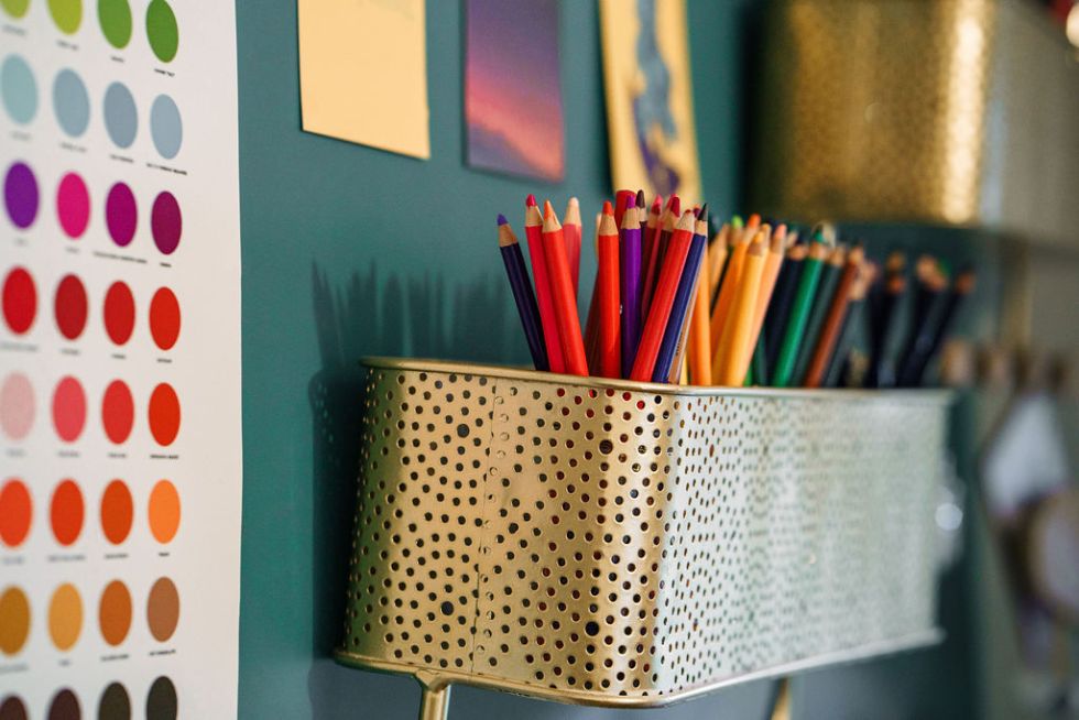 Colourful pencils and colourchart in Reyhana Ismail's studio. Image by Rachel Ovenden.