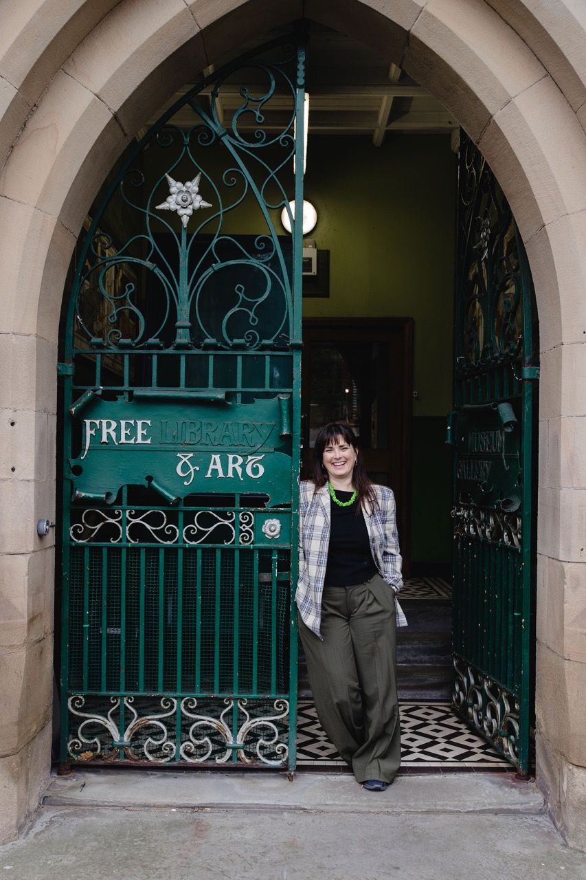 Rebecca Johnson at the gates to Blackburn Museum & Art Gallery. c. Christina Davies, Fish2Photo.