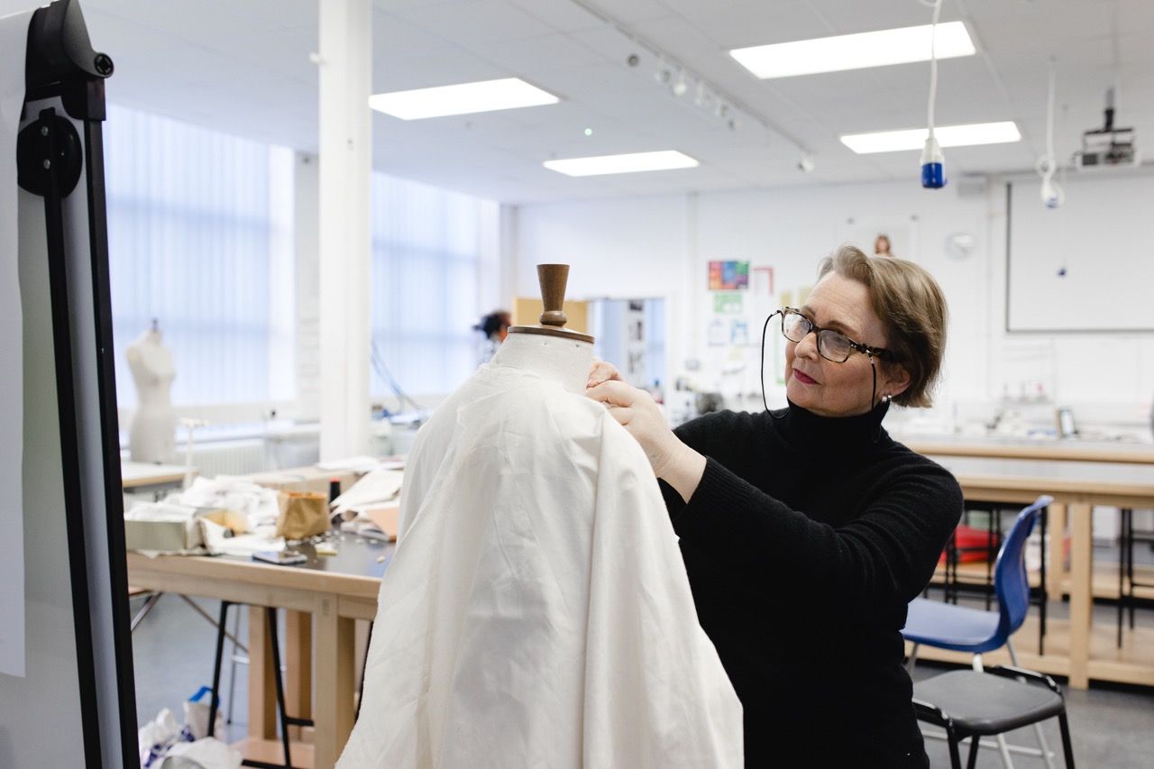 Angy Young working on a fashion piece at Blackpool School of Arts, photo by Christina Davies.