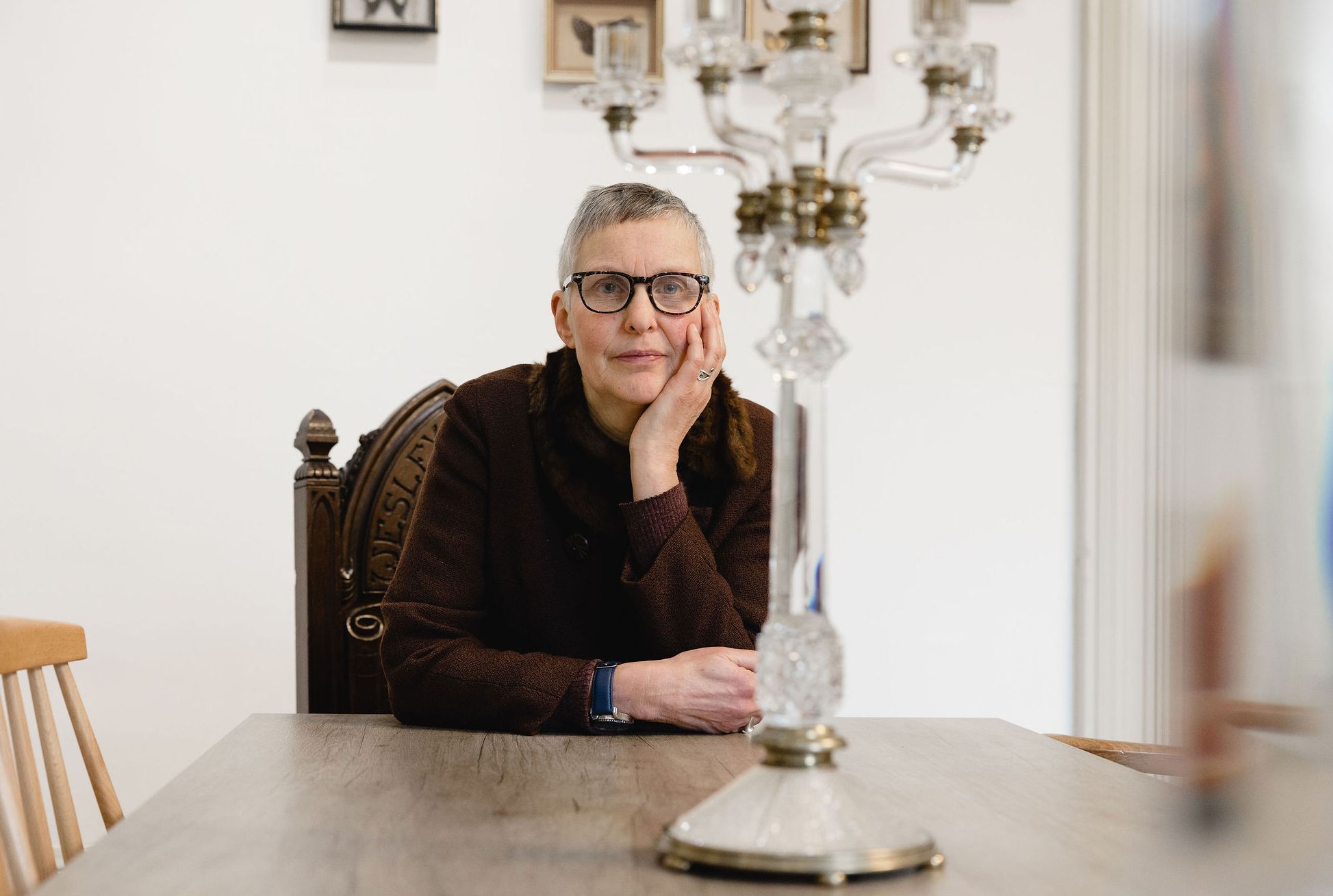 Marjan Wouda seated at a table at The Whitaker Museum. Image by Christina Davies, Fish2Photo.