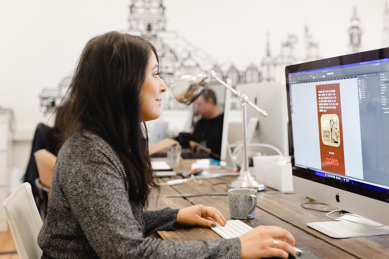 Louiza Cookson-Rabouhi working on a design on her iMac in the studio