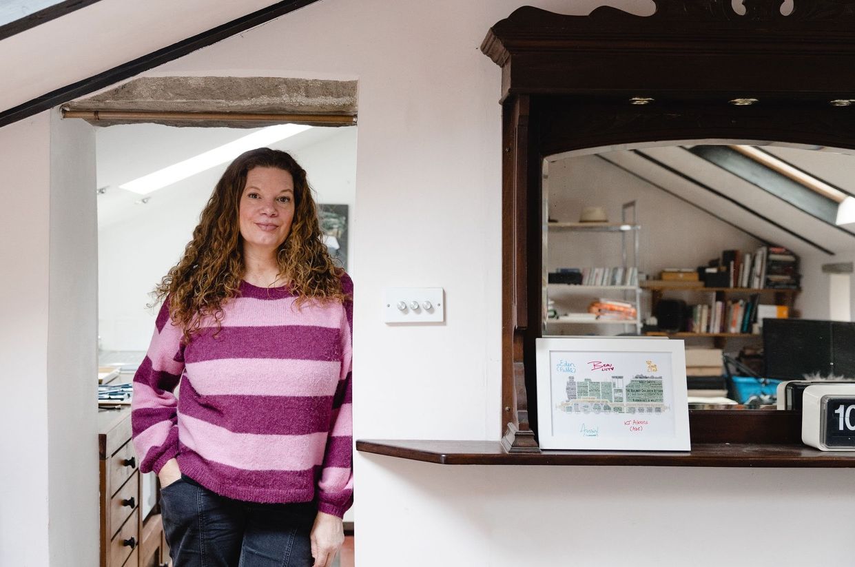 Jemma Rodgers leaning against a wall in her home. Image by Christina Davies, Fish2Photo.